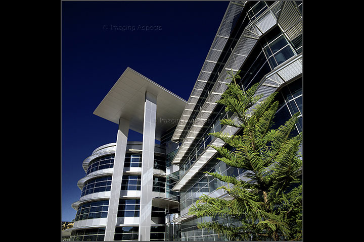 Low camera angle of commercial office building exterior with aluminium facade in Richmond, Victoria.