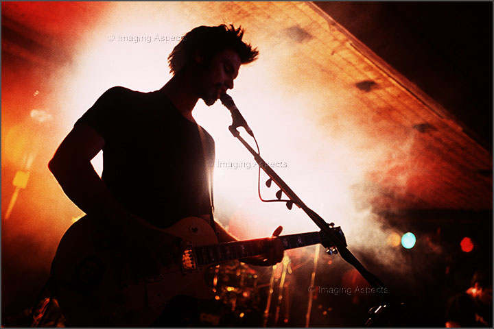 Silhouette of Cog’s singer / guitarist Flynn Gower at the Armadale Hotel, Victoria, Australia.